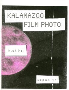 image of the front cover of kzoo film photo issue 11 zine, the cover is black with a pink moon partially visible. text reads "KALAMAZOO FILM PHOOTO, HAIKU, ISSUE 11"